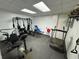 Workout room with rubber flooring and various exercise machines at 5254 Franklin Goldmine Rd, Cumming, GA 30028