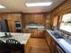 Modern kitchen with stainless steel appliances, including granite countertops at 5254 Franklin Goldmine Rd, Cumming, GA 30028