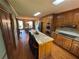 Well-lit kitchen with stainless steel appliances and views into the dining room at 5254 Franklin Goldmine Rd, Cumming, GA 30028