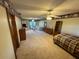 Comfortable living room featuring carpet, ceiling fans, and natural light at 5254 Franklin Goldmine Rd, Cumming, GA 30028
