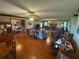Large living room with fireplace, hardwood floors, neutral paint, and ample natural light at 5254 Franklin Goldmine Rd, Cumming, GA 30028