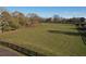 Expansive pasture bordered by wooden fence and mature trees surrounding a sprawling lot at 5254 Franklin Goldmine Rd, Cumming, GA 30028