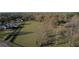Vast acreage, partially fenced, featuring mature trees and a few dwellings in the landscape at 5254 Franklin Goldmine Rd, Cumming, GA 30028