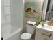 Clean bathroom with white fixtures, gold accents, and a bathtub-shower combination at 5728 Norman Ct, Atlanta, GA 30349