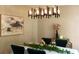 Elegant dining room with modern chandelier, stylish decor, and a white tablecloth at 5728 Norman Ct, Atlanta, GA 30349
