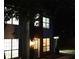 Home exterior shot at night, lights on at 5728 Norman Ct, Atlanta, GA 30349