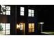 Exterior shot of the home at night, lights on at 5728 Norman Ct, Atlanta, GA 30349