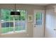 Bright kitchen area with a view to the backyard through a large window and white door at 5728 Norman Ct, Atlanta, GA 30349
