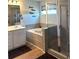 Bathroom featuring a tub, separate glass shower, and wood-look floors at 860 Point Place Dr, Loganville, GA 30052
