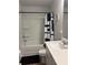 A well-maintained bathroom features a shower and tub, complemented by a clean white sink and vanity at 860 Point Place Dr, Loganville, GA 30052