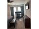 This bedroom includes neutral walls, TV, desk, ceiling fan, and dark brown dresser at 860 Point Place Dr, Loganville, GA 30052