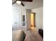 Well-lit bedroom showcasing a comfortable bed and open access to additional room space with natural lighting at 860 Point Place Dr, Loganville, GA 30052