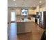 Bright, open kitchen with stainless appliances, island, and granite countertops at 860 Point Place Dr, Loganville, GA 30052