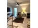 Cozy living room featuring a ceiling fan, comfortable seating, and a decorative coffee table at 860 Point Place Dr, Loganville, GA 30052