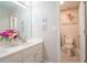Well-lit bathroom with double vanity, and separate toilet room featuring modern decor at 3819 Meandering Sw Way, Lilburn, GA 30047