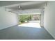 Spacious two-car garage with an open door revealing a view of the home's exterior at 3819 Meandering Sw Way, Lilburn, GA 30047