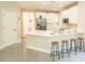 Bright, open kitchen featuring a breakfast bar, modern appliances, and plenty of counter space at 3819 Meandering Sw Way, Lilburn, GA 30047