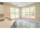 Bright eat-in kitchen features large windows, stainless steel appliances, and bar stool seating at 3819 Meandering Sw Way, Lilburn, GA 30047