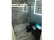 Modern bathroom with glass shower, floating vanity, vessel sink, and unique tile flooring at 5325 Pheasant Run, Stone Mountain, GA 30087