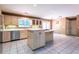 Traditional-style kitchen with an island, stainless steel appliances, and bright countertops at 5325 Pheasant Run, Stone Mountain, GA 30087