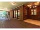 Covered outdoor patio with brick walls, stained-glass ceiling detail and views of the surrounding landscape at 5325 Pheasant Run, Stone Mountain, GA 30087