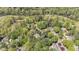 Stunning aerial view showcases homes nestled in a lush, green, wooded community near a lake at 105 Grogans Lake Dr, Atlanta, GA 30350