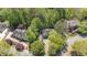 Aerial view of the beautiful community, showcasing lush greenery, mature trees, and well-manicured lawns at 105 Grogans Lake Dr, Atlanta, GA 30350