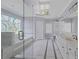 Spacious bathroom features a soaking tub with stained glass window and double sink vanity with marble countertops at 105 Grogans Lake Dr, Atlanta, GA 30350