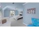 Bright bedroom features a queen bed, light blue walls, ceiling fan, and a large window with white curtains at 105 Grogans Lake Dr, Atlanta, GA 30350