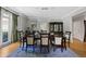 Elegant dining room with hardwood floors, chandelier, and a large window at 105 Grogans Lake Dr, Atlanta, GA 30350