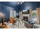 Stylish home office with a fireplace, built-ins, and ample natural light at 105 Grogans Lake Dr, Atlanta, GA 30350