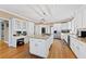 Bright, spacious kitchen with a large center island, stainless steel appliances, and white cabinetry at 105 Grogans Lake Dr, Atlanta, GA 30350