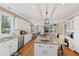 Spacious kitchen featuring a large island with seating and stainless steel appliances at 105 Grogans Lake Dr, Atlanta, GA 30350