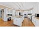 Bright kitchen featuring granite countertops, a large island, and modern appliances at 105 Grogans Lake Dr, Atlanta, GA 30350