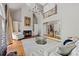 Elegant living room with fireplace, hardwood floors, custom cabinets and access to the upstairs balcony at 105 Grogans Lake Dr, Atlanta, GA 30350