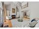 Bright living room featuring a fireplace, large windows, and an open view to the upper level at 105 Grogans Lake Dr, Atlanta, GA 30350