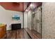 Unique wine cellar with glass enclosure and stone accents, perfect for showcasing your collection and entertaining guests at 105 Grogans Lake Dr, Atlanta, GA 30350