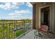 Charming balcony featuring a comfortable seating area and scenic views of the lush greenery and swimming pool below at 1820 Peachtree Nw St # 804, Atlanta, GA 30309