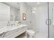 Modern bathroom with a marble countertop vanity and a frameless glass shower showcasing a clean and luxurious design at 1820 Peachtree Nw St # 804, Atlanta, GA 30309