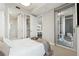 Stylish bedroom with access to a balcony and ensuite bathroom, enhancing the space's appeal and functionality at 1820 Peachtree Nw St # 804, Atlanta, GA 30309