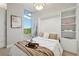 Bright bedroom featuring a built-in Murphy bed and shelving, complemented by natural light from a large window at 1820 Peachtree Nw St # 804, Atlanta, GA 30309
