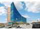 Exterior view of a modern glass office building with surrounding city street and traffic at 1820 Peachtree Nw St # 804, Atlanta, GA 30309
