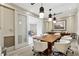 Modern conference room featuring a large table, comfortable seating, and stylish lighting fixtures at 1820 Peachtree Nw St # 804, Atlanta, GA 30309
