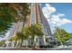 Stunning full exterior view of a high-rise building with balconies and landscaped surroundings at 1820 Peachtree Nw St # 804, Atlanta, GA 30309