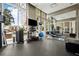 Functional gym featuring a mirrored wall and essential equipment like dumbbells, a rowing machine, and exercise balls at 1820 Peachtree Nw St # 804, Atlanta, GA 30309