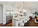 Bright kitchen with stainless steel appliances, island seating, and modern pendant lighting at 1820 Peachtree Nw St # 804, Atlanta, GA 30309