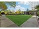 Expansive lawn area, perfect for outdoor activities and relaxation, set against a backdrop of elegant architecture at 1820 Peachtree Nw St # 804, Atlanta, GA 30309