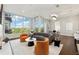 Inviting living room with large windows, stylish furniture, and views of lush greenery at 1820 Peachtree Nw St # 804, Atlanta, GA 30309