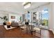 Bright living area with large windows, a fireplace, and a balcony overlooking city views at 1820 Peachtree Nw St # 804, Atlanta, GA 30309