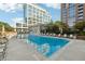Resort-style pool with lounge chairs and umbrella in an urban setting with views of modern buildings at 1820 Peachtree Nw St # 804, Atlanta, GA 30309